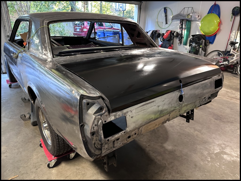 Rear driver-side view with trunk lid attached, temporarily.