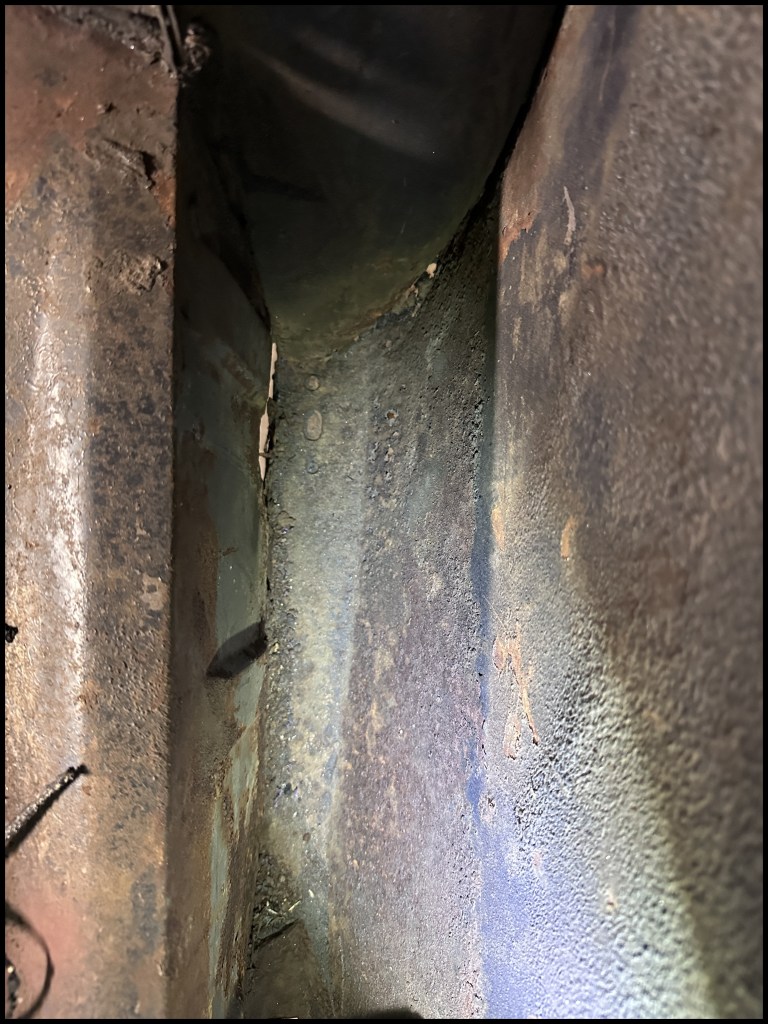 Passanger-side trunk rear fender rust rot damage.