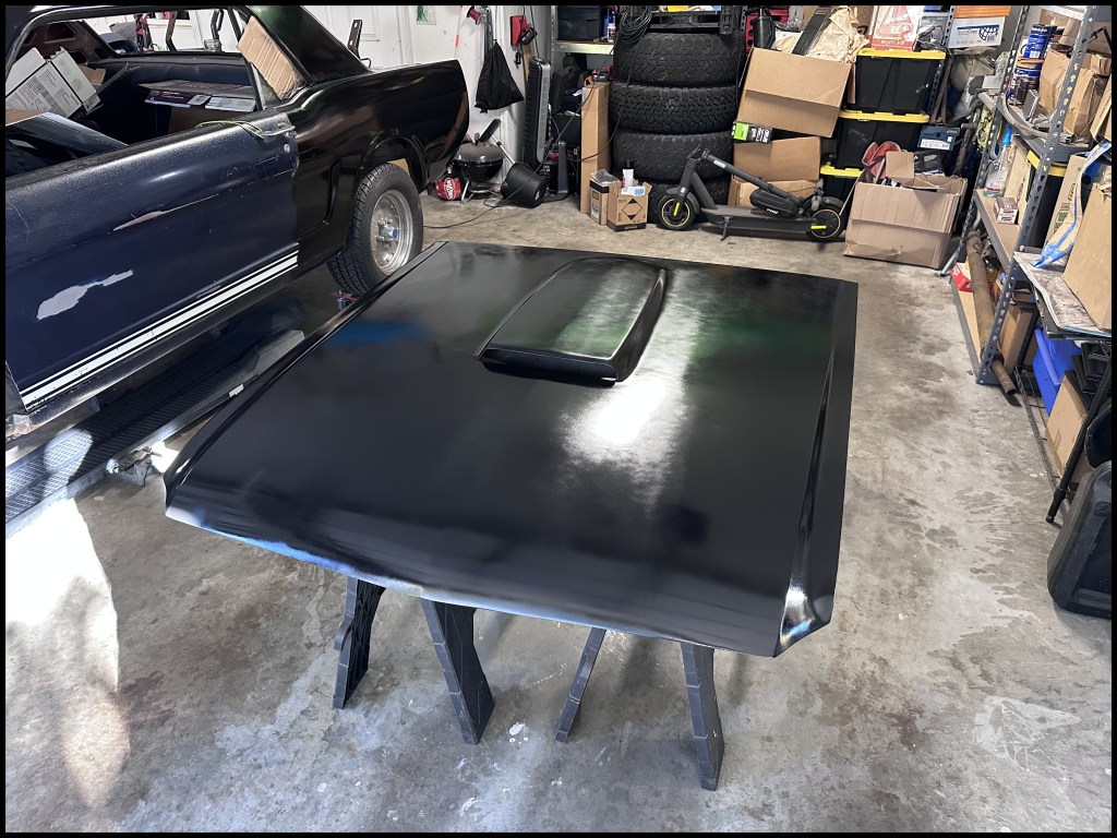 Repainting the hood to match color of exterior coating.