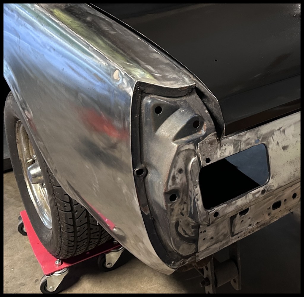 Small dent in the rear driver-side fender before I did some light body work.